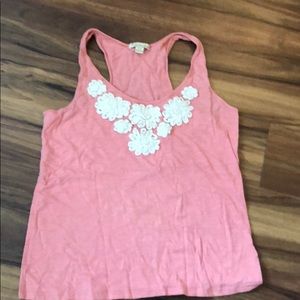 Pink tank top with floral appliqué